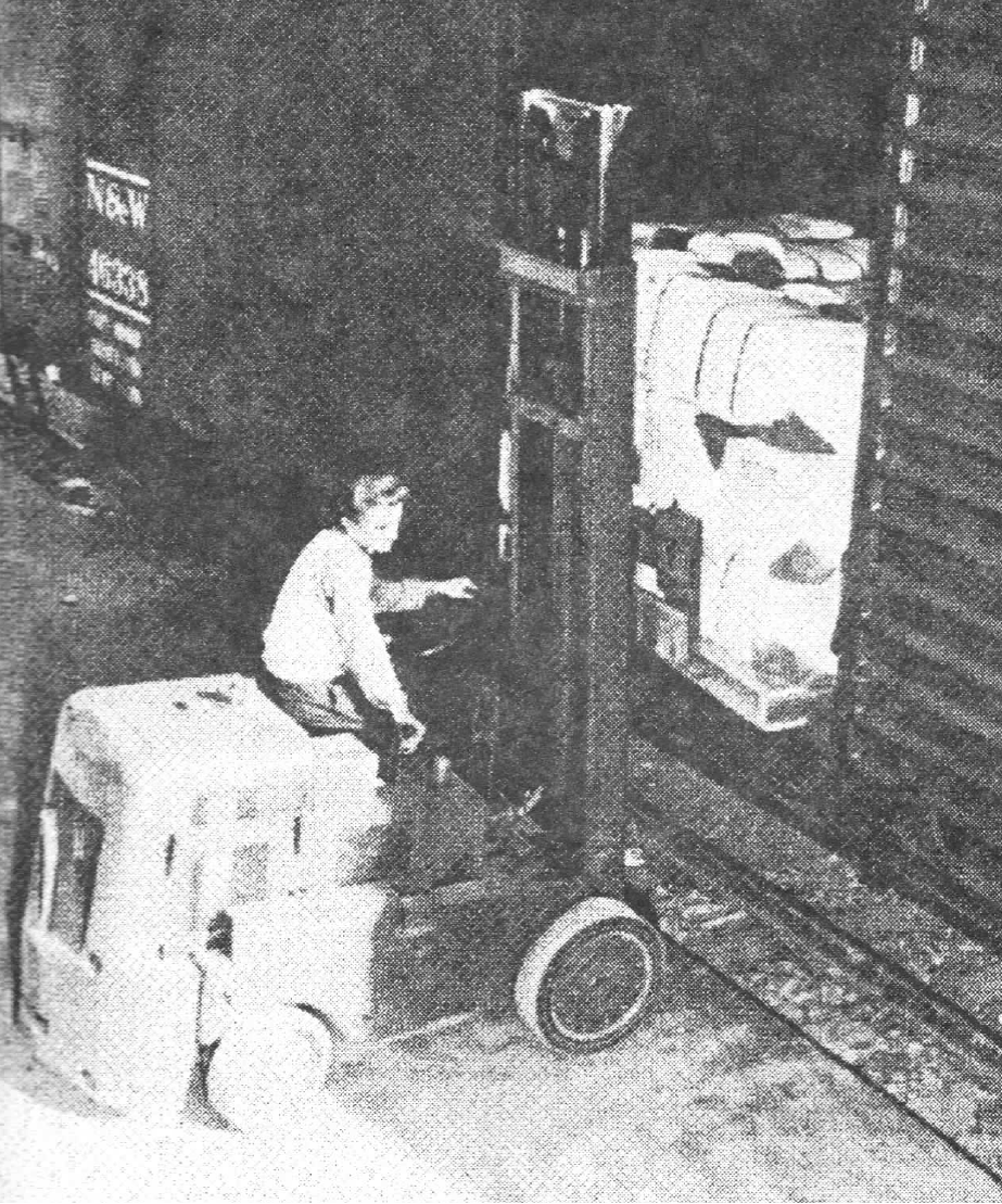 Lift truck loading of bailed uniforms during WWII
