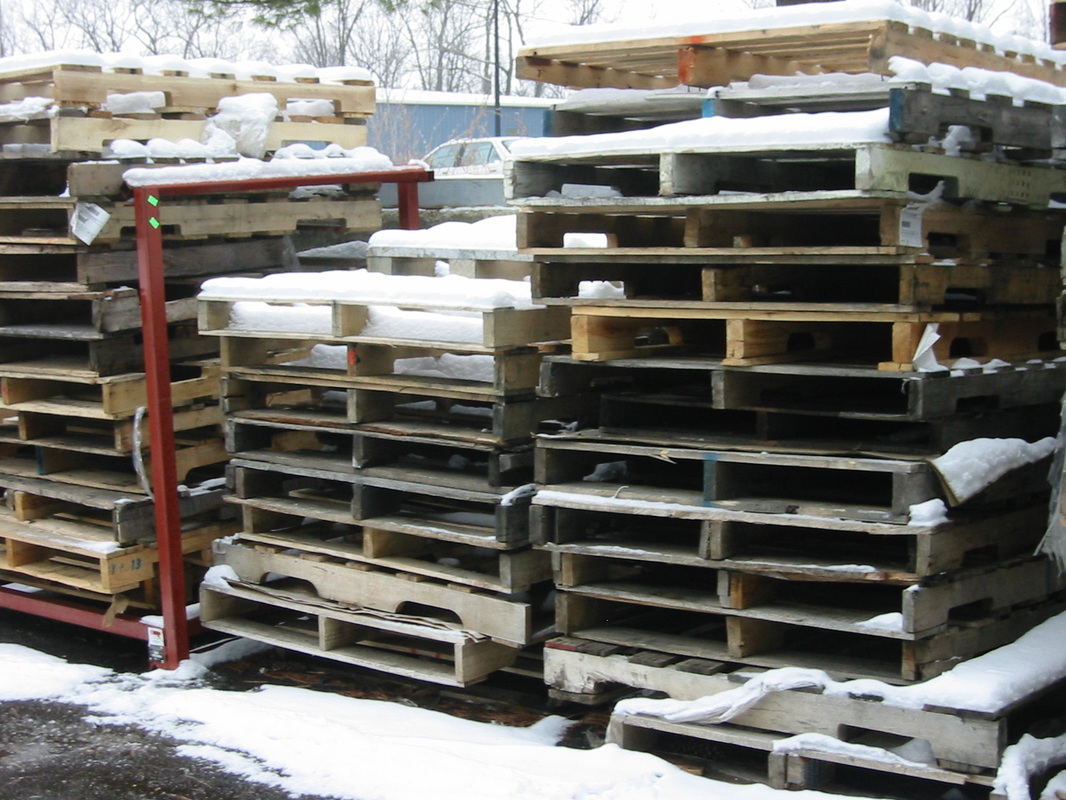 Snow covered wooden pallets